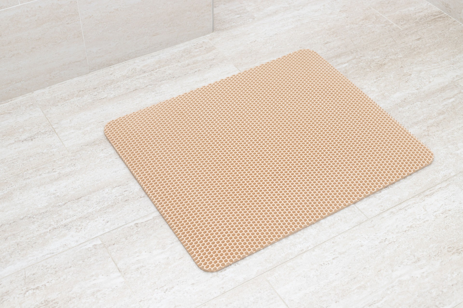 Cat litter trapping mat on bathroom floor